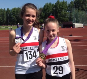 Bethany Milton & Sadie McNulty show off their medals won at Merseyside AA T&F Championships