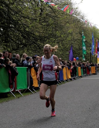 Kirsty Longley gritting her teeth as she comes home to win the Spring 10k at Sefton Park