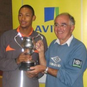 MMike receives the Blaire trophy from former coach John Bradshaw for the outstanding performance by a Merseyside athlete at a National Championship