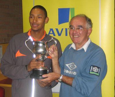 MMike receives the Blaire trophy from former coach John Bradshaw for the outstanding performance by a Merseyside athlete at a National Championship