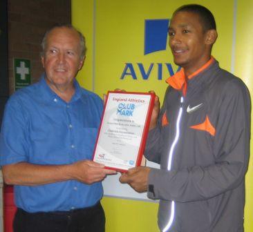 Mike Rimmer present s LPS Secretary Wally Bridson with the Club Mark Award