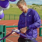 Steve Cram cuts the tape to open the new sports facilities at Edge Hill