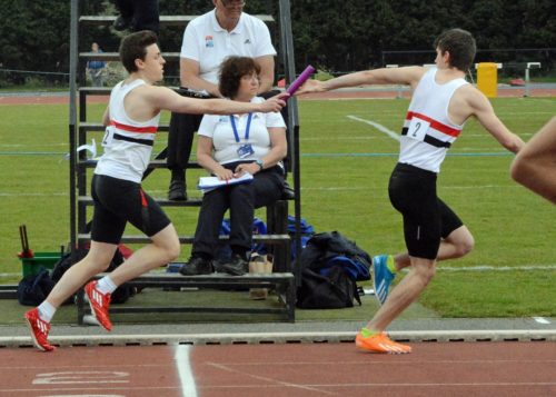 Relay change-over Ed Latimer to Joe Milton