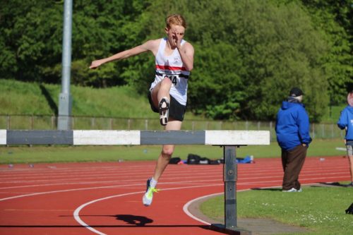 Adam Jones on route to Under 20 steeple chase title