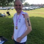 John Halson all smiles after completing his first triathlon