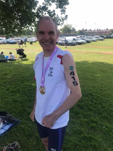 John Halson all smiles after completing his first triathlon